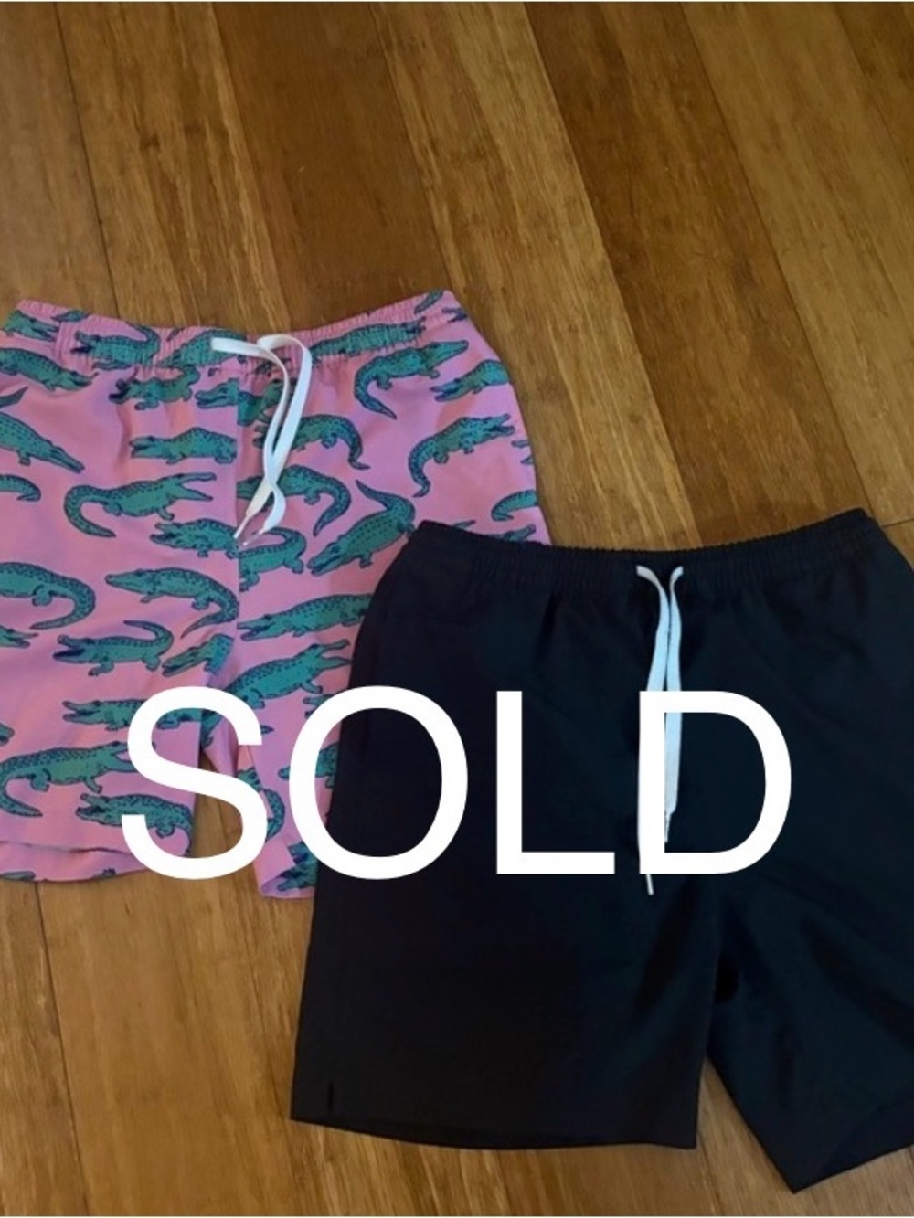 Chubbies 
1 Pink Crocodile Print & 1 Black swim trunk
Boys Large